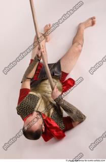 MARCUS LAYING POSE WITH SPEAR
